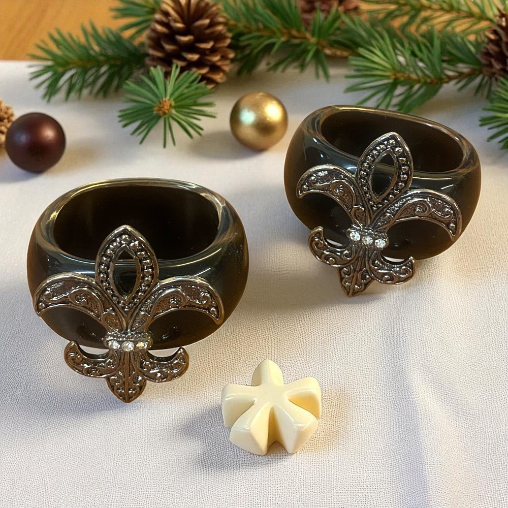 A pair of Fleur De Lys Napkin Rings