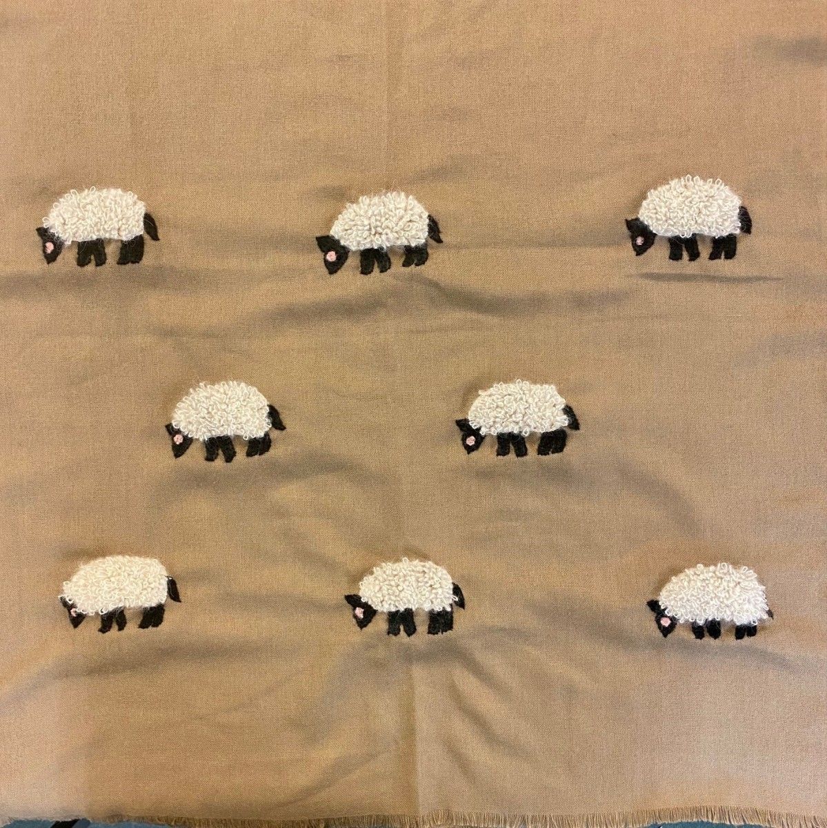 White Mohair Sheep on Beige Scarf