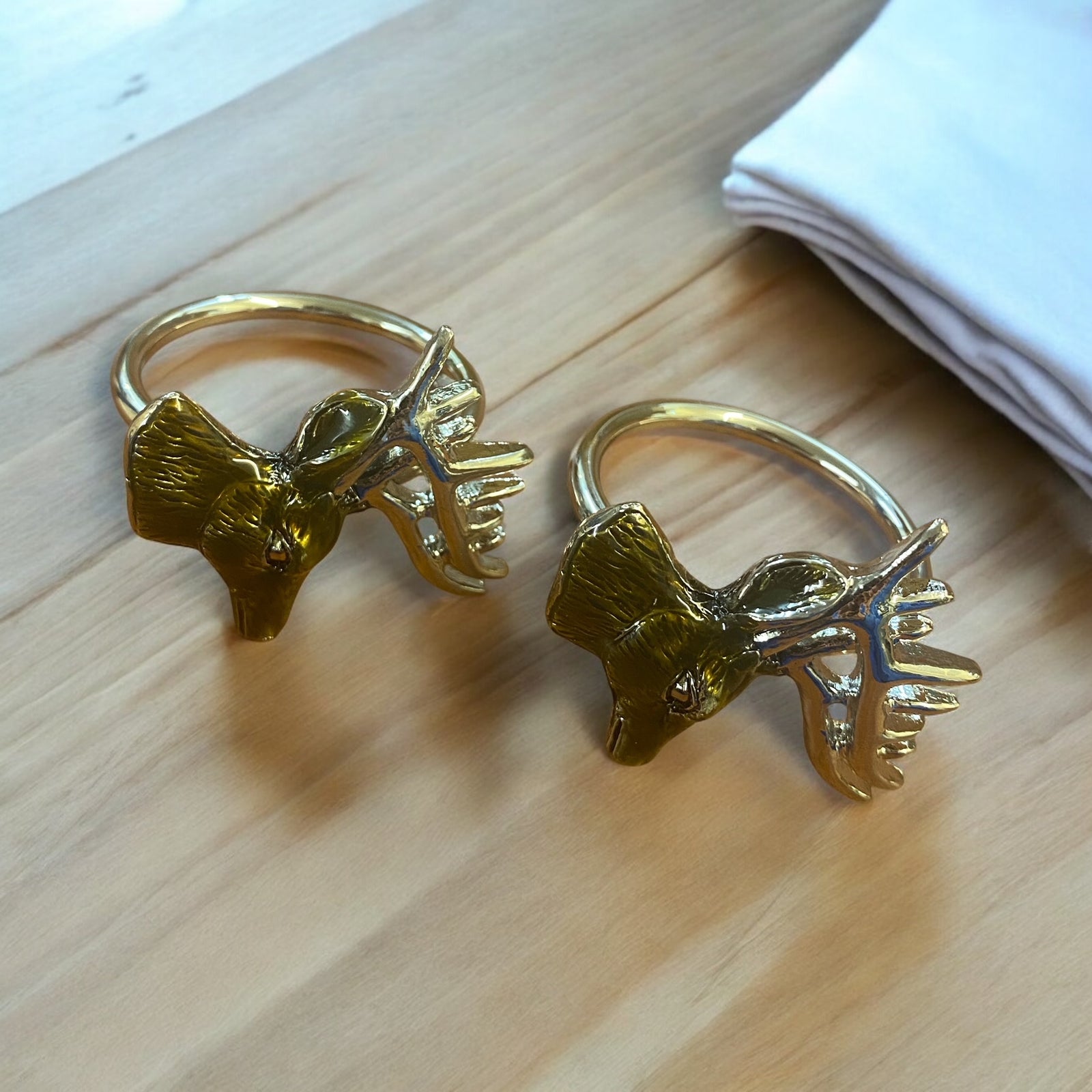A Pair of Stag Enamel Napkin Rings