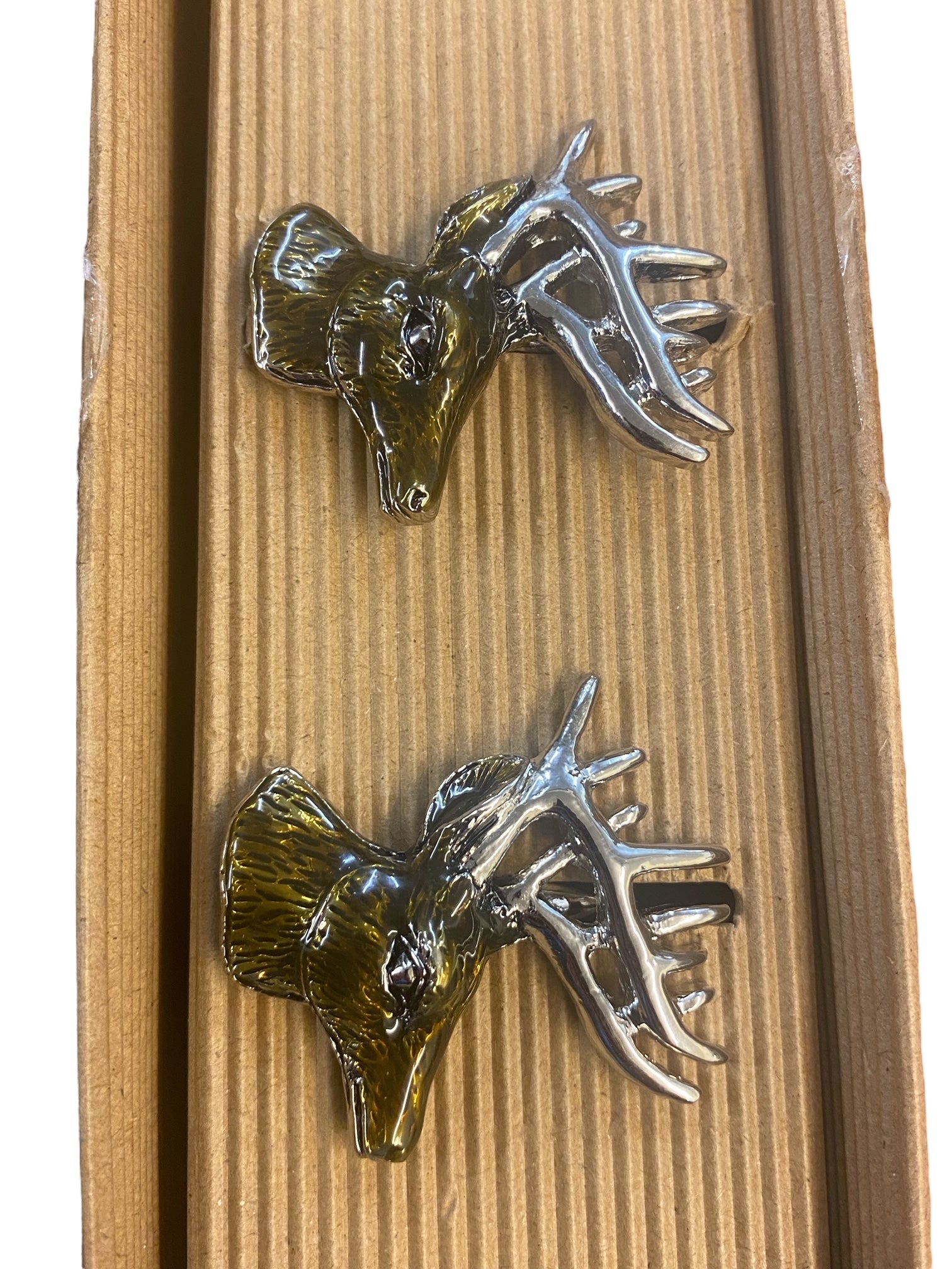 A Pair of Stag Enamel Napkin Rings